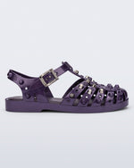 Side view of a purple Possession Studs fisherman sandal with silver studs.