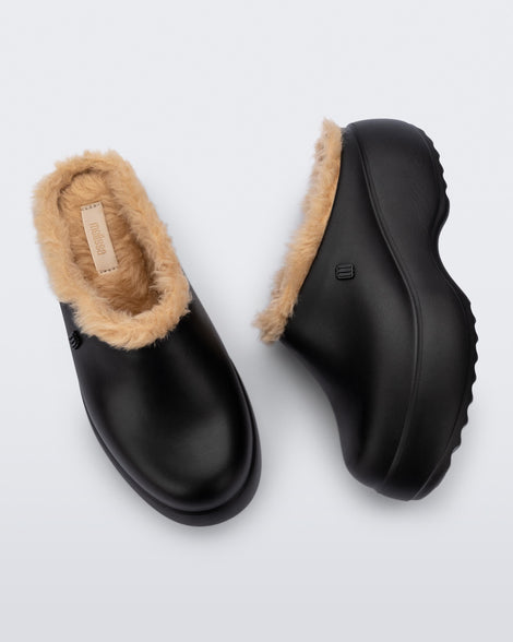 Top and side view of a pair of black Free Clog Fluffy Platforms with dark beige fluffy liner