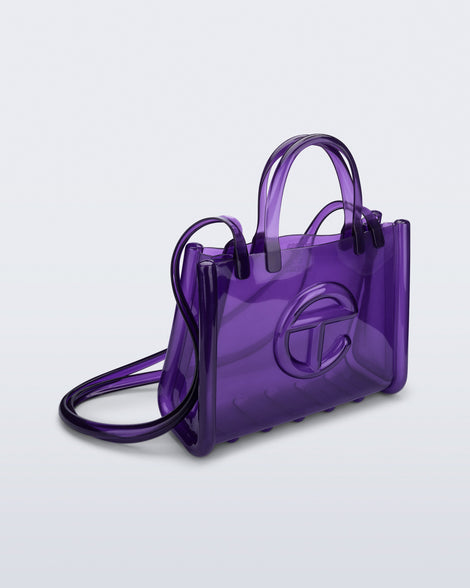 Angled view of the purple Medium Jelly Shopper x Telfar bag