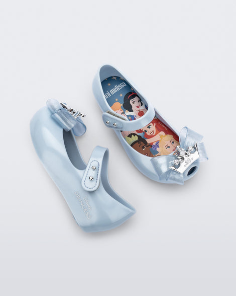 Angled and side view of a pair of pearly blue baby Ultragirl Princess flats