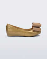 Side view of a pearly beige kids Ultragirl Classic Bow kids flats