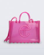 Front view of the pink Large Jelly Shopper x Telfar bag