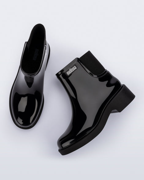 Top and side view of a pair of black Chelsea Boots.