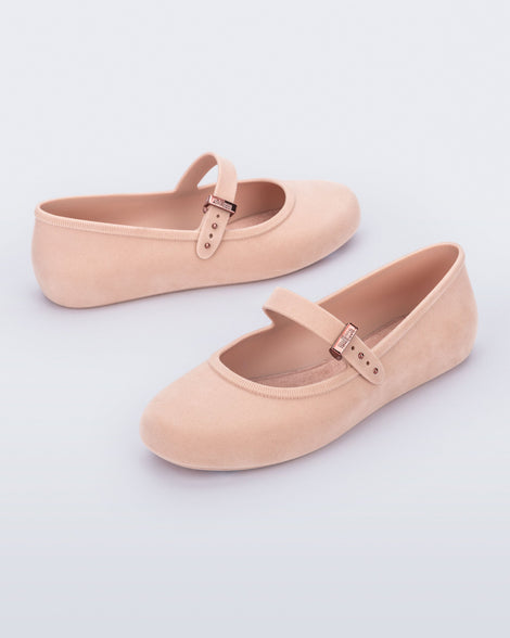 Side angled view of a pair of pink Soft Ballerina Velvet flats