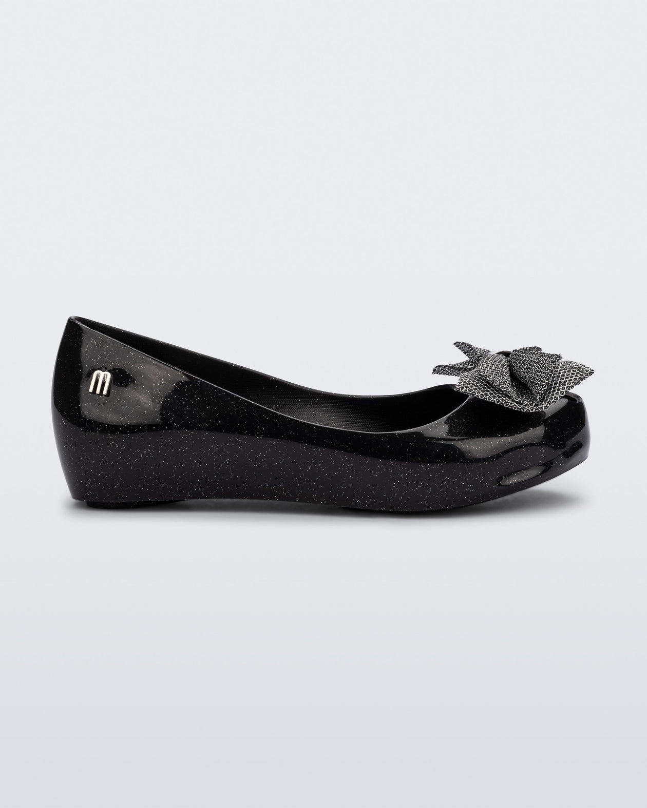 Side view of a glitter black Ultragirl Sweet kids ballerina flat with bow