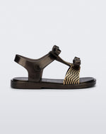 Side view of a black baby Dream Sandal with two bows and gold detail on strap