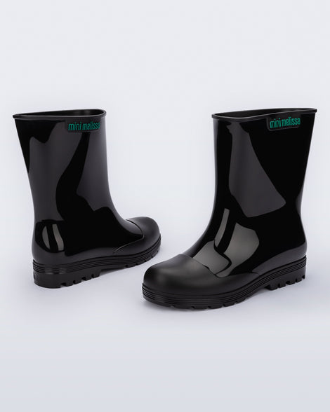 Back and side view of a pair of black kids Welly rainboots.