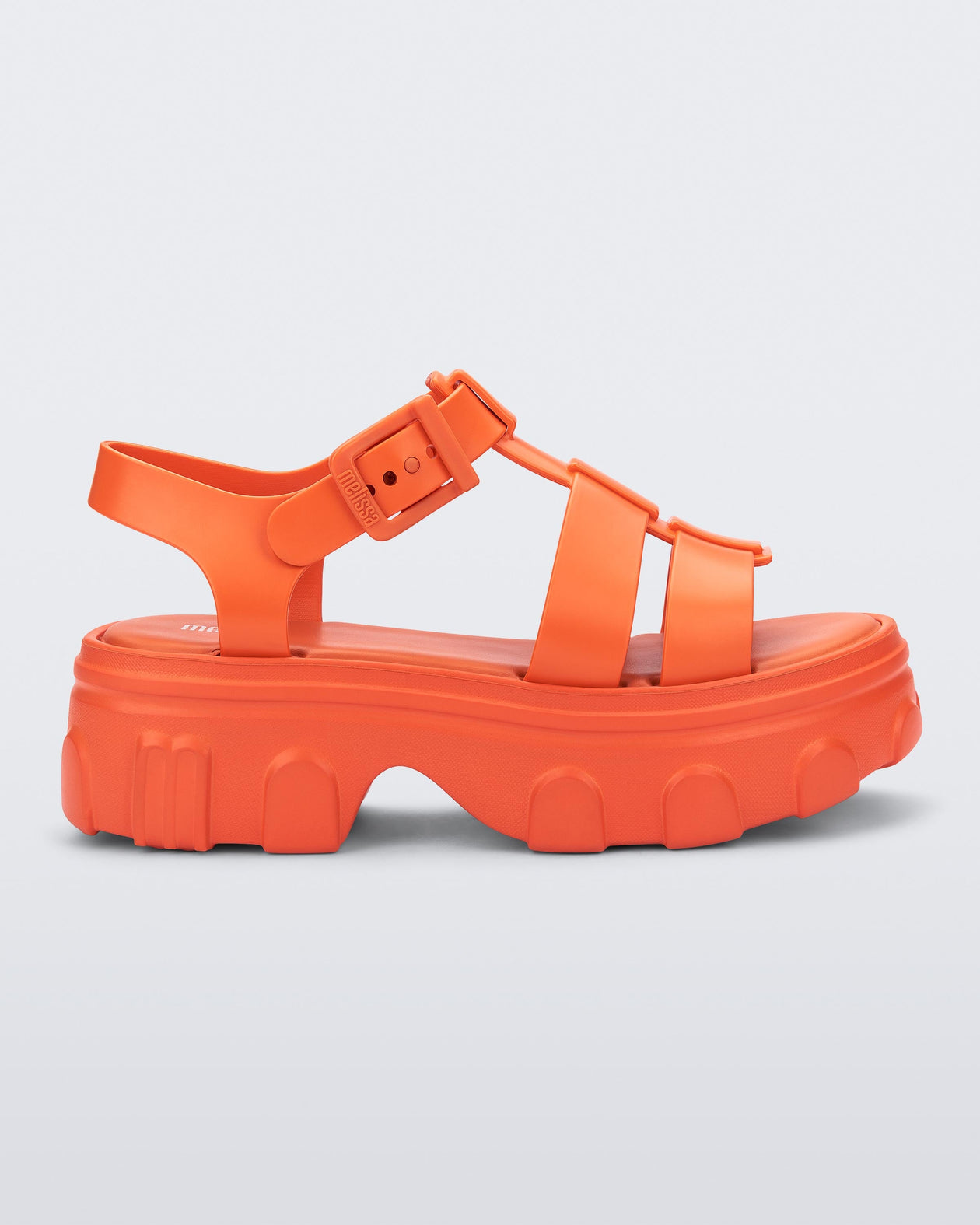 Side view of a orange Ella platform adult sandal