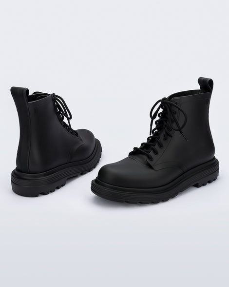 Back and side view of a pair of black Coturno Soft boots