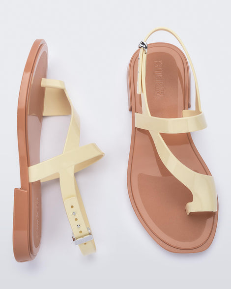 Top and side view of pair of beige Cassie sandals.