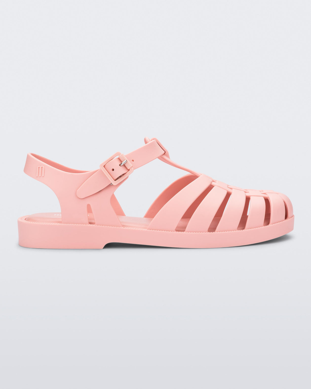 Side view of a light pink Possession sandal