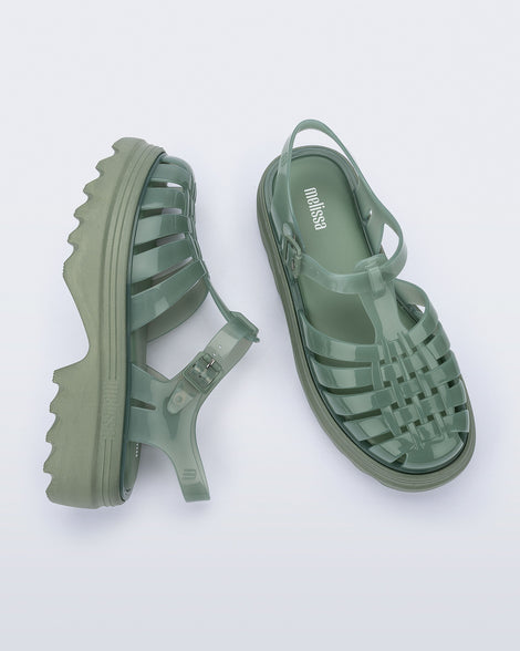 Side and top view of a pair of green Possession Platform II sandals.