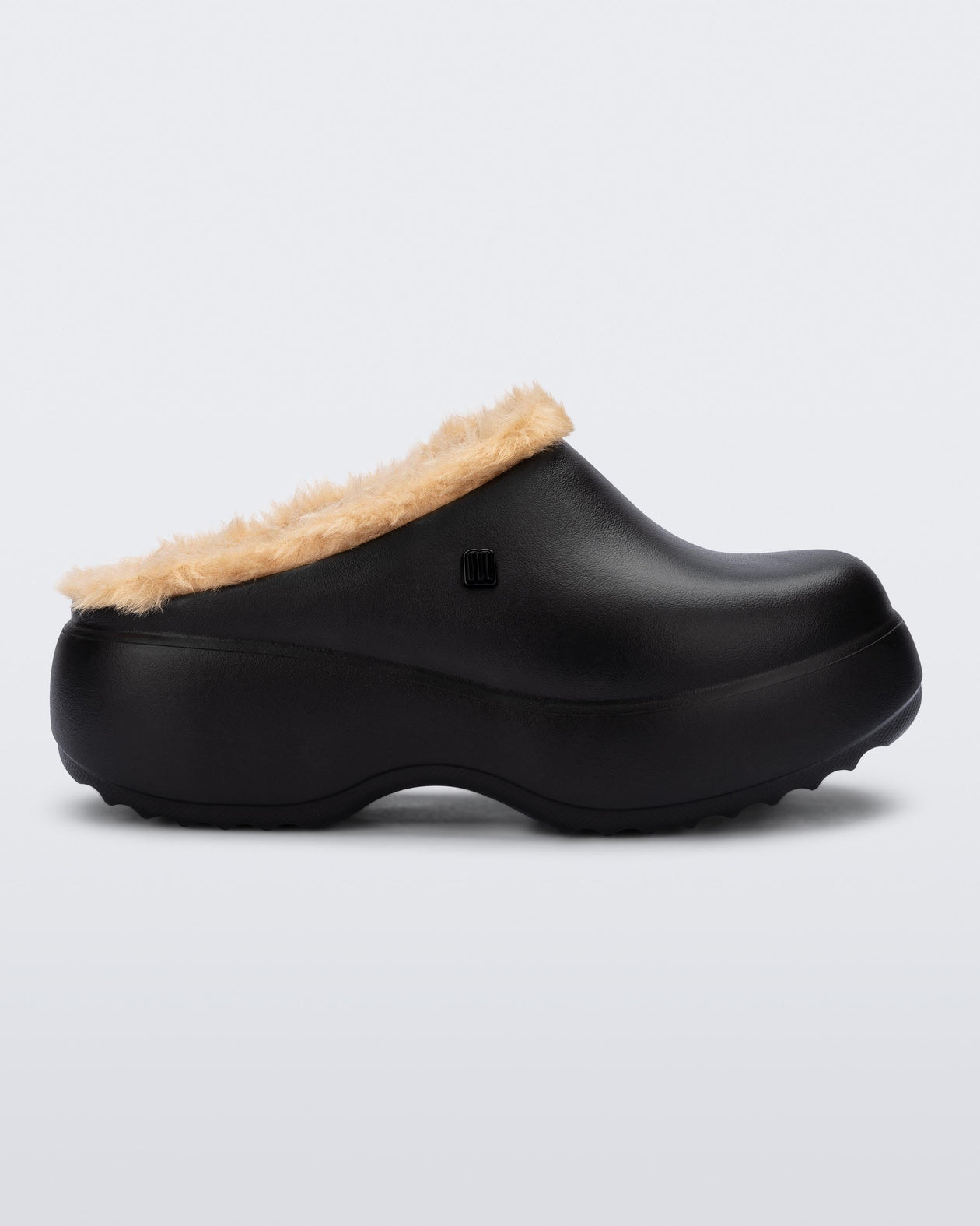 Side view of a black Free Clog Fluffy Platform with dark beige fluffy liner