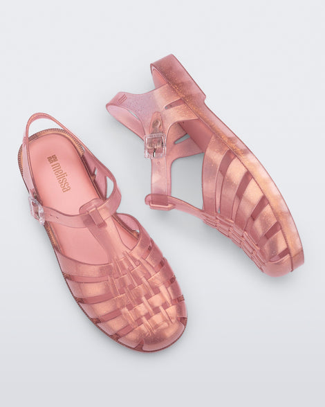 Top view of a pair of pearly pink Possession sandals