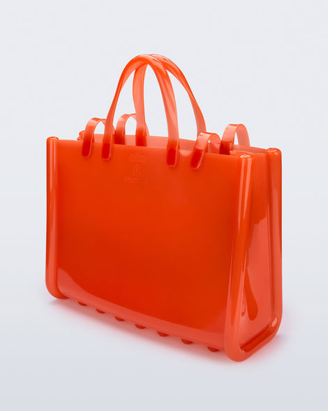 Back view of the orange Large Jelly Shopper x Telfar bag