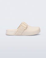 Side view of a beige kids Cozy Clog