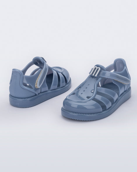 Back and angled view of a pair of blue baby Hip Daydream sandals