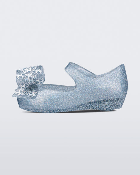 Inner side view of a clear glitter baby Ultragirl frozen flat.