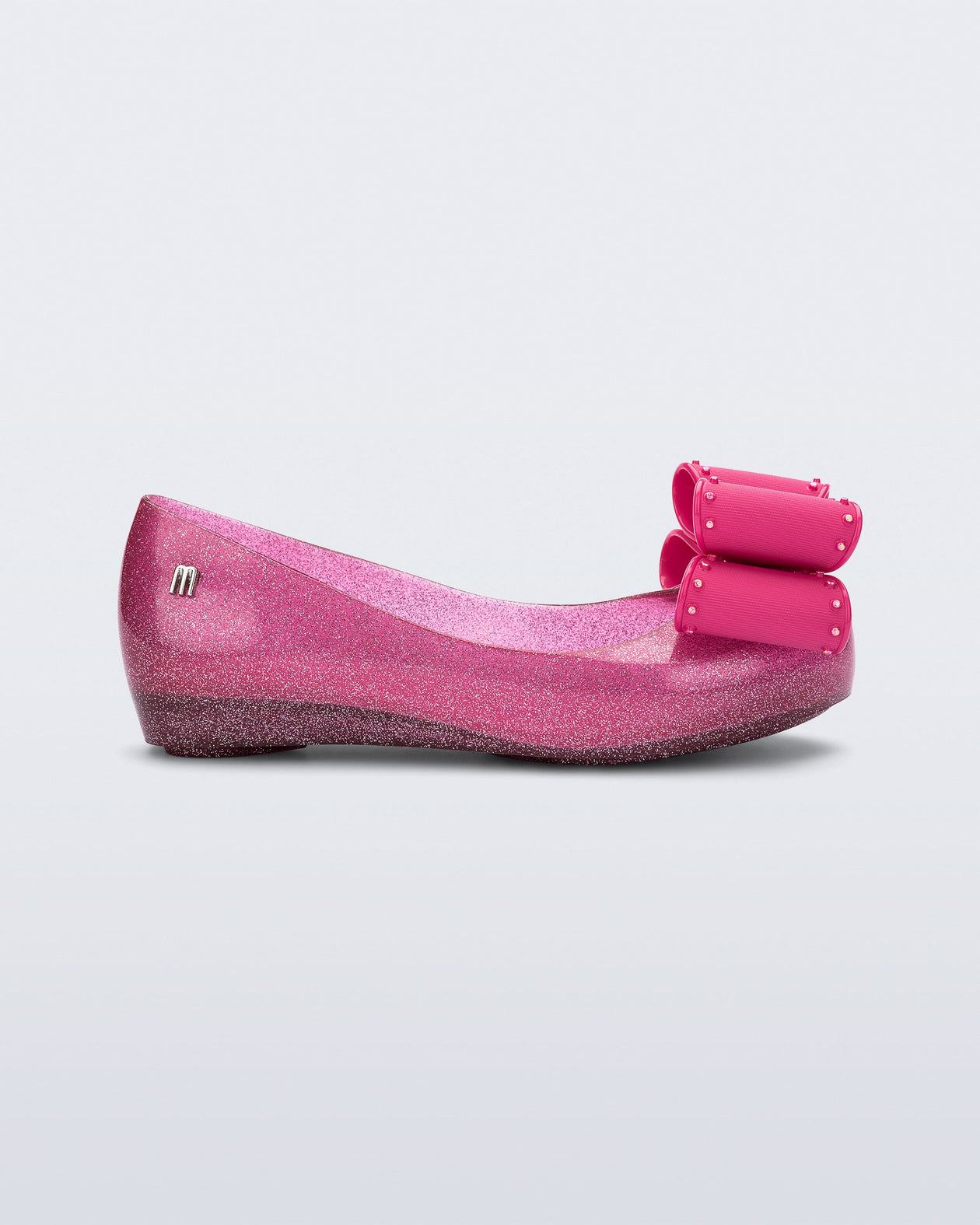 Side view of a glitter pink kids Ultragirl Classic Bow kids flats