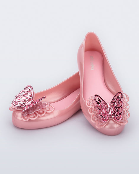 Angled view of a pair of pink Sweet Love kids flats