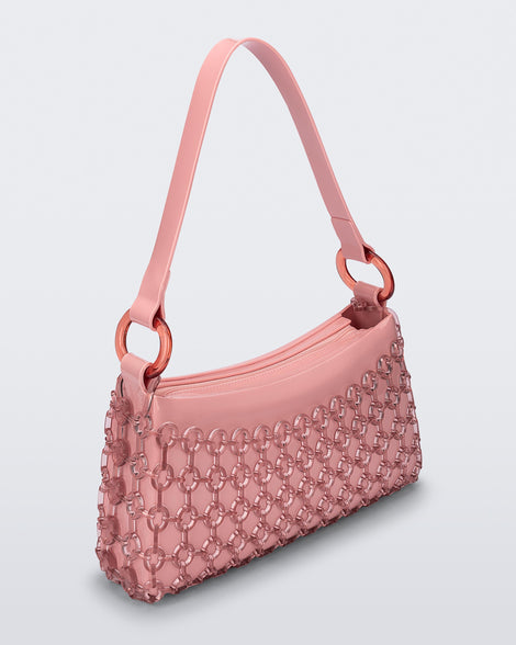 Angled view of a pink Hoop bag with short shoulder strap