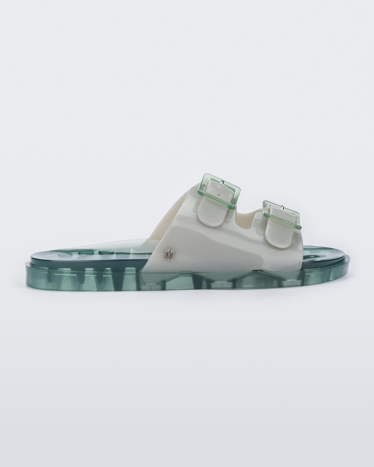 Side view of a Melissa Wide slide sandal with green sole and two grey/green front straps