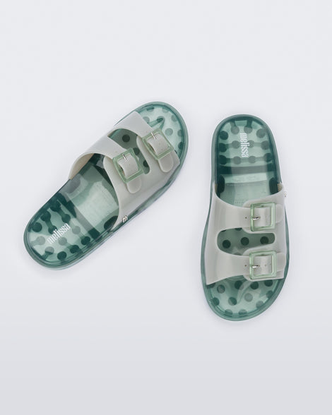 Top view of a pair of Melissa Wide slide sandals with green sole and two grey/green front straps