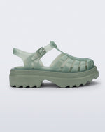 Side view of a green Possession Platform II sandal.