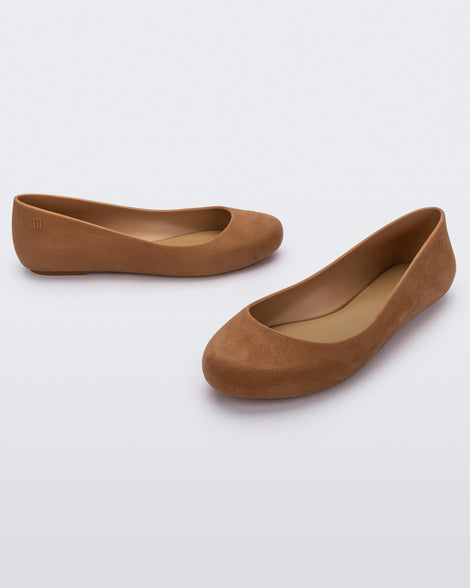 Angled view of a pair of beige flocked Melissa Sweet Love Basic Velvet flats.