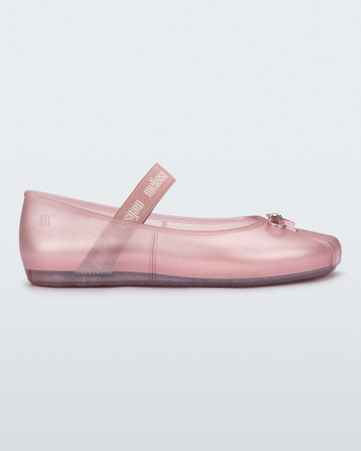 Side view of a glitter pink Sophie flat.