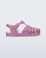 Side view of a glitter pink kids Possession sandal.