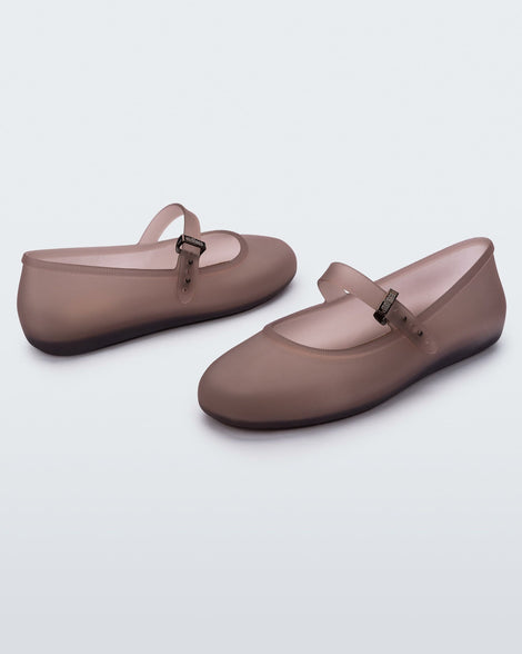 Angled view of a pair of clear brown Soft Ballerinas