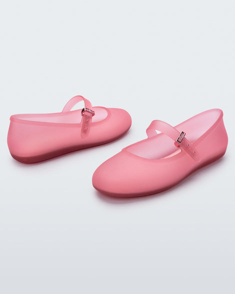 Angled view of a pair of clear pink Soft Ballerinas.