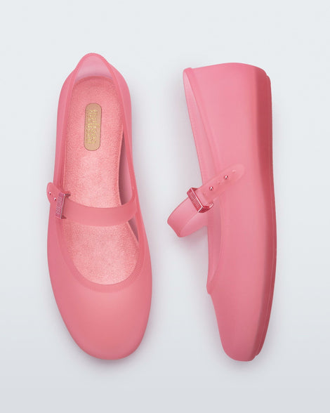 Side and top view of a pair of clear pink Soft Ballerinas.