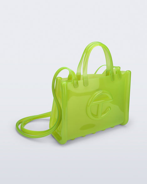 Angled view of the green Medium Jelly Shopper x Telfar bag