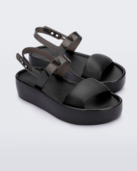 Angled view of a pair of black Float Platforms.