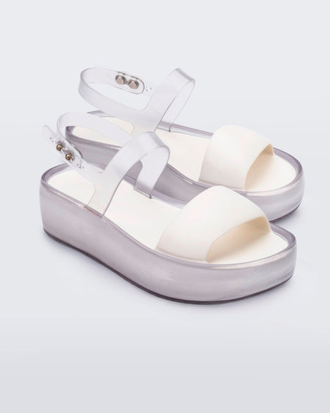 Angled view of a pair of clear/white Float Platforms.