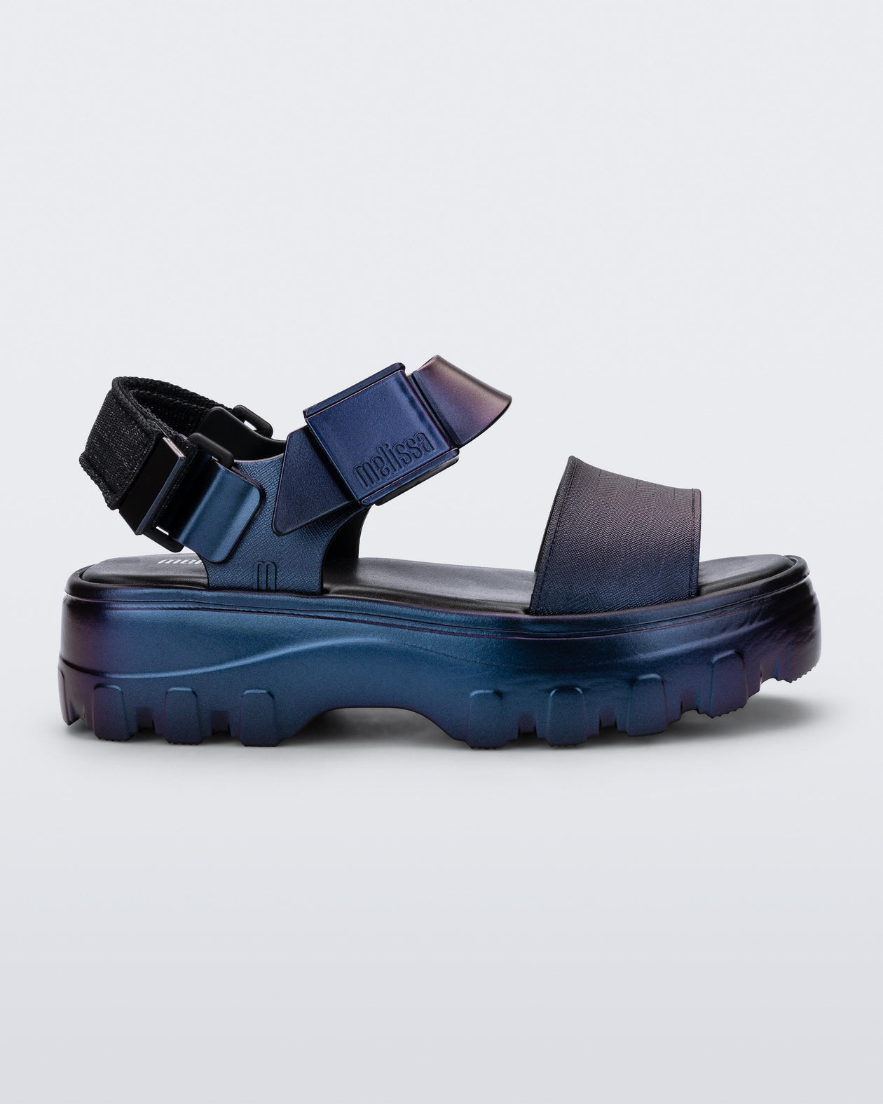 Side view of a metallic blue Kick Off Sandal