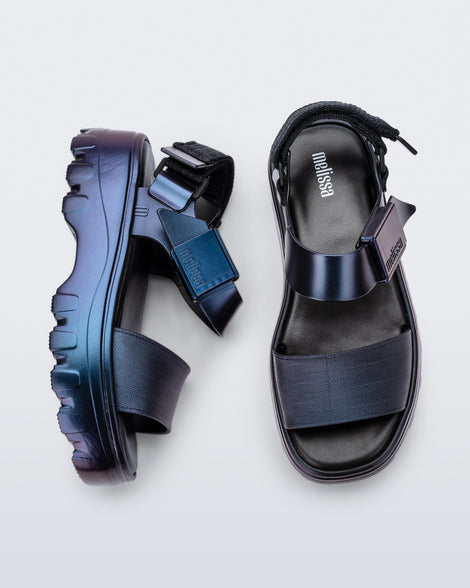 Top and side view of a pair of metallic blue Kick Off sandals