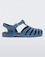 Side view of a blue jean Possession sandal.