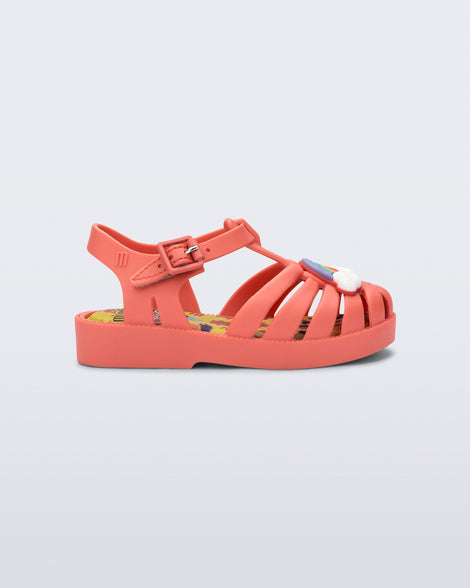 Side view of a matte red baby Possession + Play Doh sandal