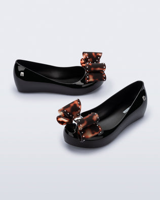 Product element, title Ultragirl Classic Bow in Black/Tortoise
 price $59.00