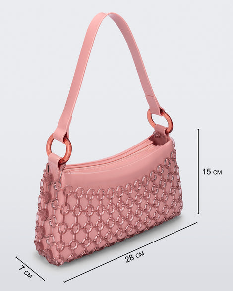 Angled view of a pink Hoop bag with short shoulder strap with bag dimensions: 28 cm x 7 cm x 15 cm