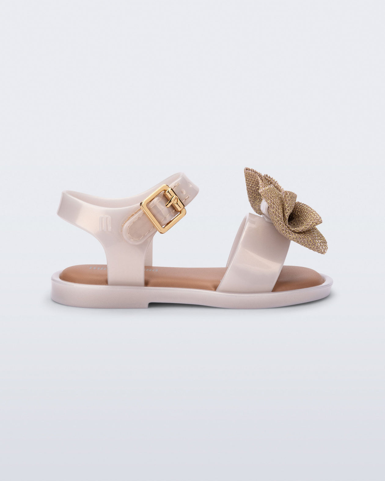 Side view of a pearly beige Mar Sweet baby sandal