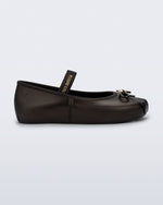 Side view of a metallic black Sophie kids ballerina flat with bow