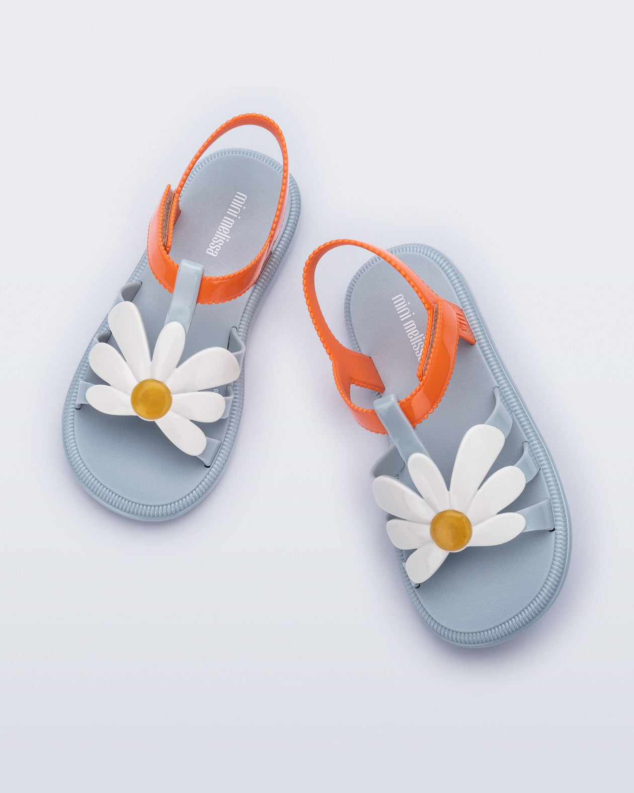 Top view of a pair of blue and orange kids Hip Bloom sandal.