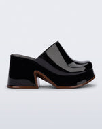 Side view of a black Mia Platform Mule Heel with brown sole