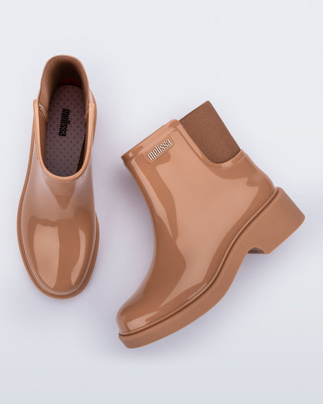 Top and side view of a pair of brown Chelsea Boots.