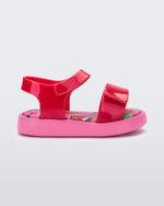 Side view of a pearly red baby Jump sandal