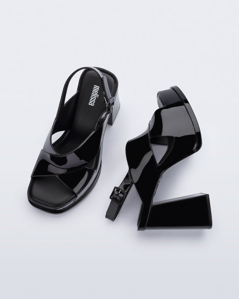 Top and side view of a pair of black Dance Heel platforms